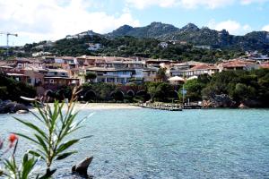a town on the shore of a body of water at appartamento Romi in Porto Cervo
