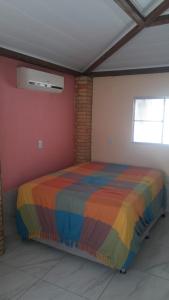 מיטה או מיטות בחדר ב-Lucena Apartamento Temporada