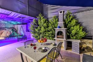 a dining room with a table and christmas trees at Likya Villa Kalkan in Kalkan