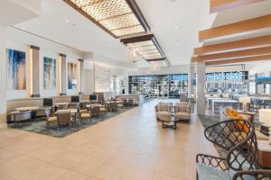 a lobby of a restaurant with tables and chairs at Residence Inn by Marriott Marina del Rey in Los Angeles