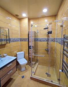 a bathroom with a shower and a toilet and a sink at Villa MD Grigoleti in Grigoleti