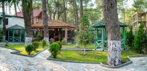 a park with a gazebo and trees at Villa MD Grigoleti in Grigoleti