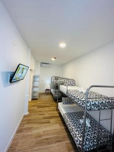 a hallway with bunk beds in a room at HOSTEL COSTA-LUZ Béjar in Huelva
