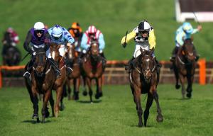 a group of horses racing on a track at Premium Deal l Hill View Home l Last-Minute Offer l Cheltenham l AJ Properties l Perfect for Short or Long Stays l 4Beds 4Bedrooms in Cheltenham
