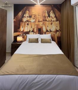 Ένα ή περισσότερα κρεβάτια σε δωμάτιο στο Celia Pyramids View inn