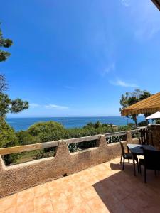 a patio with a view of the ocean at Residence VILLA MOROSI - Favone in Conca