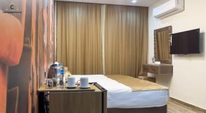Μια τηλεόραση ή/και κέντρο ψυχαγωγίας στο Celia Pyramids View inn