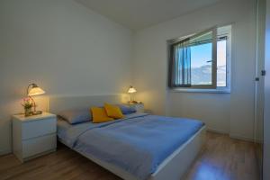 Postel nebo postele na pokoji v ubytování Residence Girasole Casa Gialla + 37 fotografií