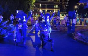 a group of people in blue costumes at night at Dreamland Oasis luxury apartment in Chakvi