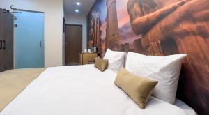 Ένα ή περισσότερα κρεβάτια σε δωμάτιο στο Celia Pyramids View inn