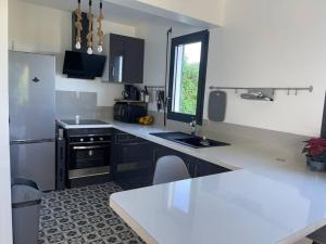 Eldhús eða eldhúskrókur á MonÉTOILE charmant bas de villa