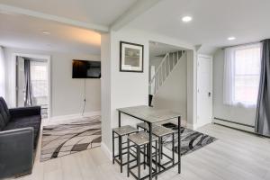 a living room with a staircase and a couch at Jersey City Vacation Rental about 8 Mi to NYC! in Jersey City