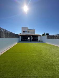 a house with a large lawn in front of it at laPotrosa in Ayamonte