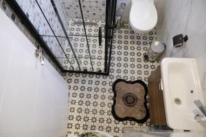a bathroom with a guitar on the wall at Taksim Neo Pera Suites in Istanbul +135 photos