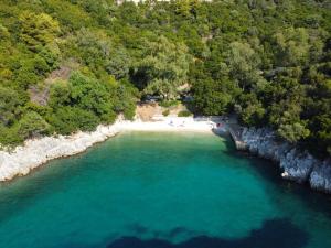 an aerial view of a beach with turquoise water at Vlastaras Apartment in Sivota
