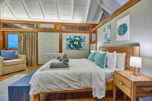 En eller flere senge i et værelse på Aloha 10 I 4Bed Villa with Stunning Sea View Pool