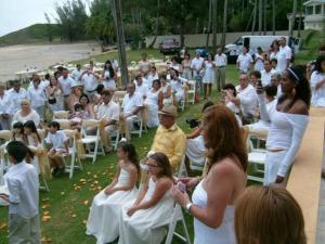 a group of people sitting in chairs at a wedding at The Views Will Take Your Breath Away - Romantic Villa on the Beach in Arecibo