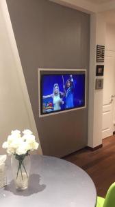 TV a/nebo společenská místnost v ubytování ATTICO LUX LE GRU