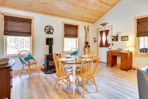 a dining room with a table and chairs at Beautiful Greig Cabin 2 Mi to Brantingham! in Glenfield