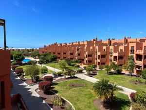an apartment complex with a park and a swimming pool at Apartment in La Tejita (El Medano) in La Tejita