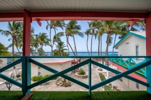 a view of the beach from the balcony at Serene by the Sea in Savaneta