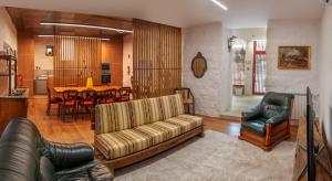 a living room with a couch and chairs and a table at Quinta de Chousas - Braga - Agroturismo in Braga