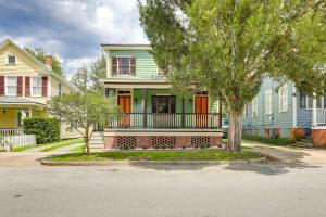 a row of houses with orange and green doors at Victorian New Bern Vacation Rental In Downtown! in New Bern