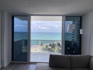 a living room with a view of the ocean at MAGNIFICENT 2 bedroom /2 bath beachfront with Beach View Condo apartment in Hollywood