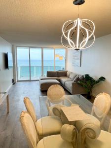 a living room with a view of the ocean at MAGNIFICENT 2 bedroom /2 bath beachfront with Beach View Condo apartment in Hollywood