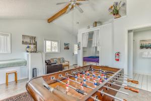a living room with a foosball table at Pearl off the Prom in Seaside