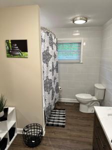 a bathroom with a toilet and a shower at Brookwood in Chattanooga