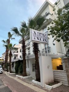 a hotel with a sign in front of a building at NFK The House Hotel in Antalya