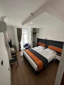 Postel nebo postele na pokoji v ubytování NFK The House Hotel