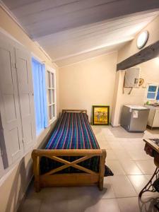 a room with a bed in a room with a window at Departamento Sofía in Tanti
