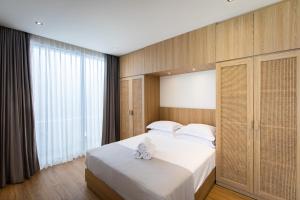 Postel nebo postele na pokoji v ubytování 20 Suites Umalas + 37 fotografií