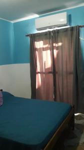 Posteľ alebo postele v izbe v ubytovaní Rosas Blancas