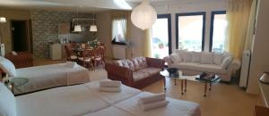 A bed or beds in a room at House with View in Amfithea