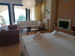 A bed or beds in a room at House with View in Amfithea