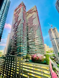 a rendering of a tall building in a city at The Arte Plus KLCC BY Tenang Homes in Kuala Lumpur