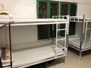 a couple of bunk beds in a room at Vernice Backpacker Hostel in Vientiane