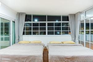 Postel nebo postele na pokoji v ubytování Fira villa Huahin + 99 fotografií