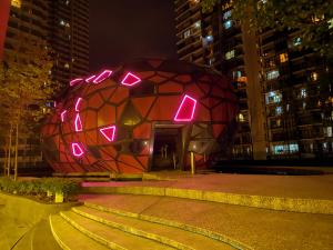 a building with a sphere with lights on it at The Arte Plus KLCC BY Tenang Homes in Kuala Lumpur
