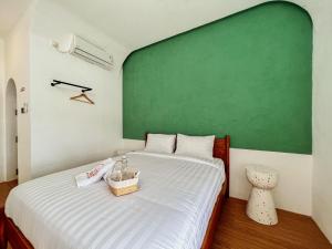 Ein Bett oder Betten in einem Zimmer der Unterkunft Renjana Beach House