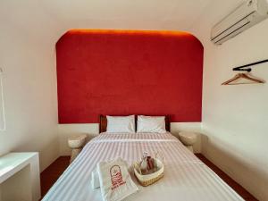 Ein Bett oder Betten in einem Zimmer der Unterkunft Renjana Beach House