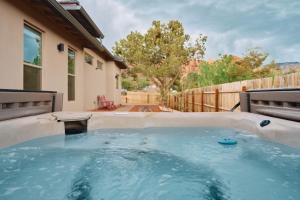 a hot tub in the backyard of a house at Sedona Desert Modern - Hot Tub & Views in Sedona