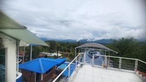 a view of a boat on a balcony of a house at Hotel spa la buena vida in Fusagasuga +132 photos