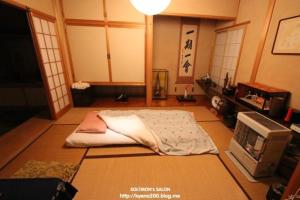 a room with a bed sitting on the floor at Guest House Chara in Hirosaki +24 photos