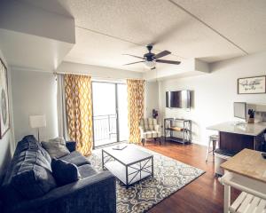 a living room with a couch and a table at Water Street Retreat 14 in Wilmington