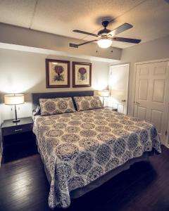 a bedroom with a bed and a ceiling fan at Water Street Retreat 14 in Wilmington