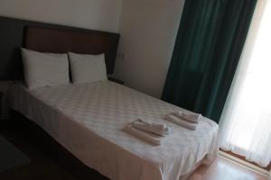 מיטה או מיטות בחדר ב-Double Comfort Otel